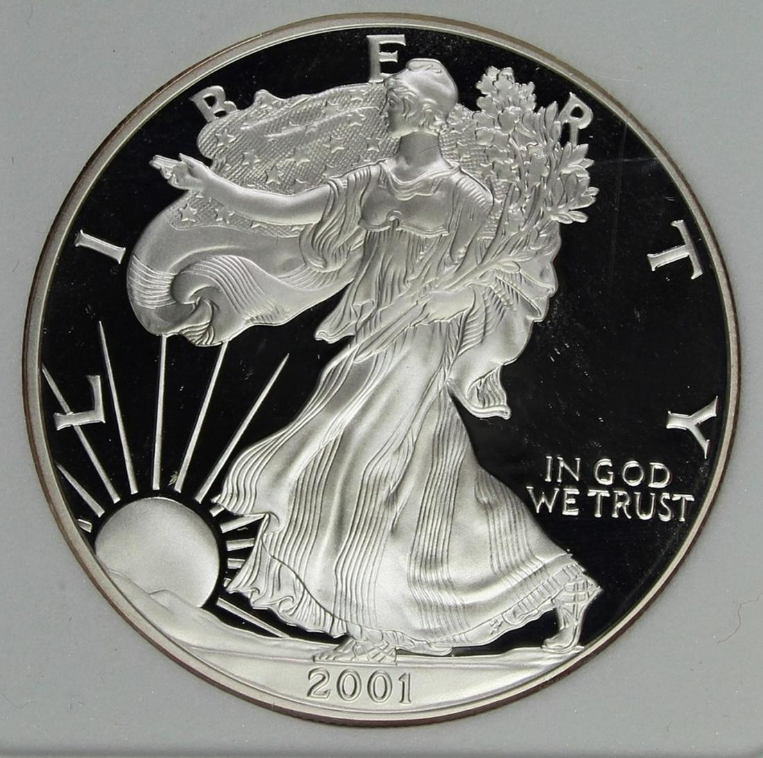 2001 AMERICAN SILVER EAGLE: PERFECT PROOF. DEEP CAMEO. AGP GRADED. COMES WITH BOX AND CERT. ESTIMATE: $250-$300