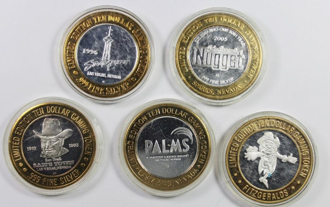 FIVE MISCELLANEOUS SILVER CASINO TOKENS (1 of 2)
