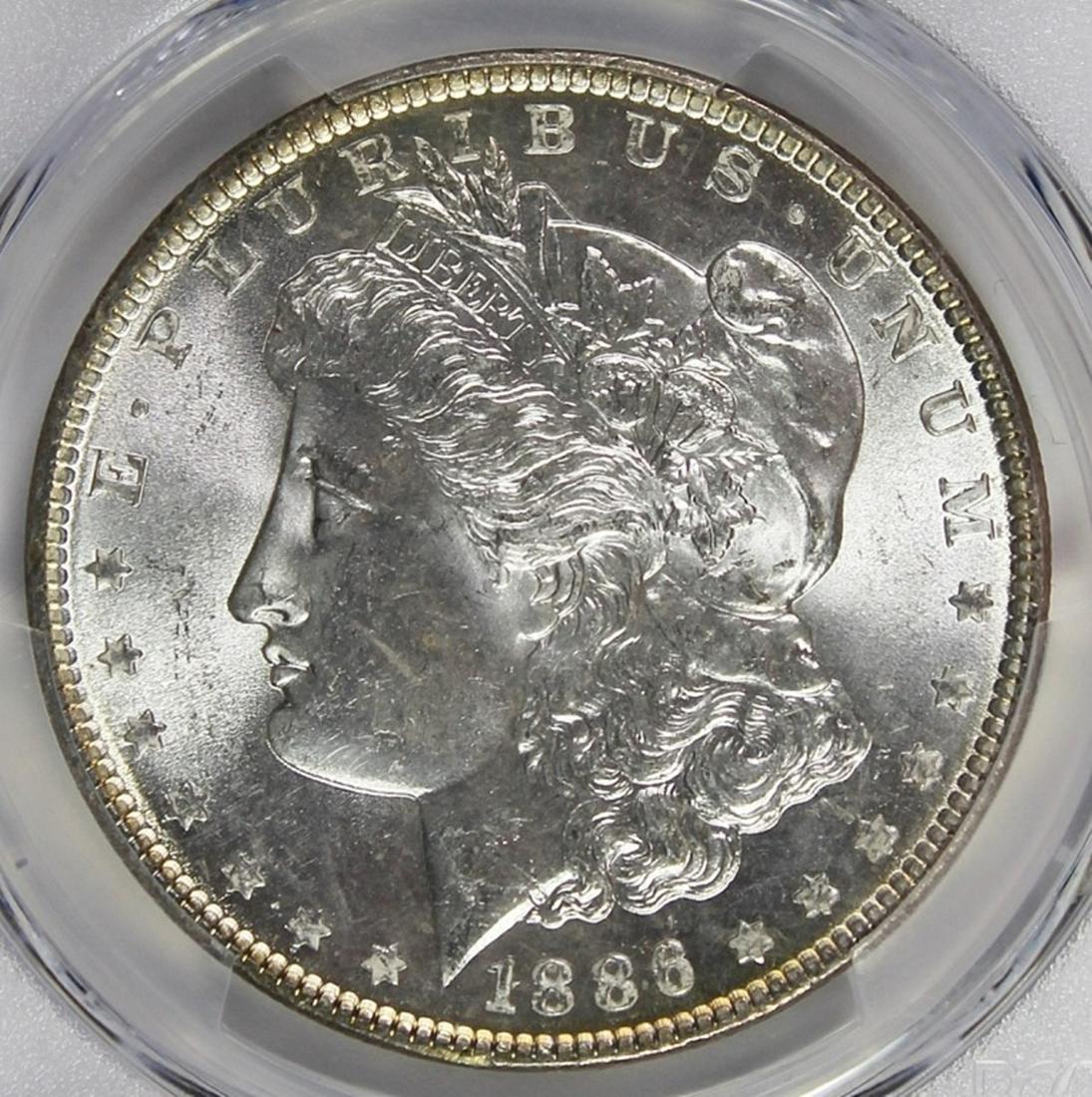 1886 MORGAN SILVER DOLLAR: PCGS MS 65 GEM. ESTIMATE: $150-$250