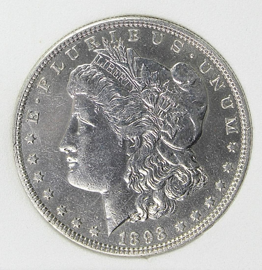 1893-O MORGAN SILVER DOLLAR: RNG GRADED. MS62 BLAST WHITE, MARK FREE SURFACES, KEY COIN! ESTIMATE: $4,000-$4,500