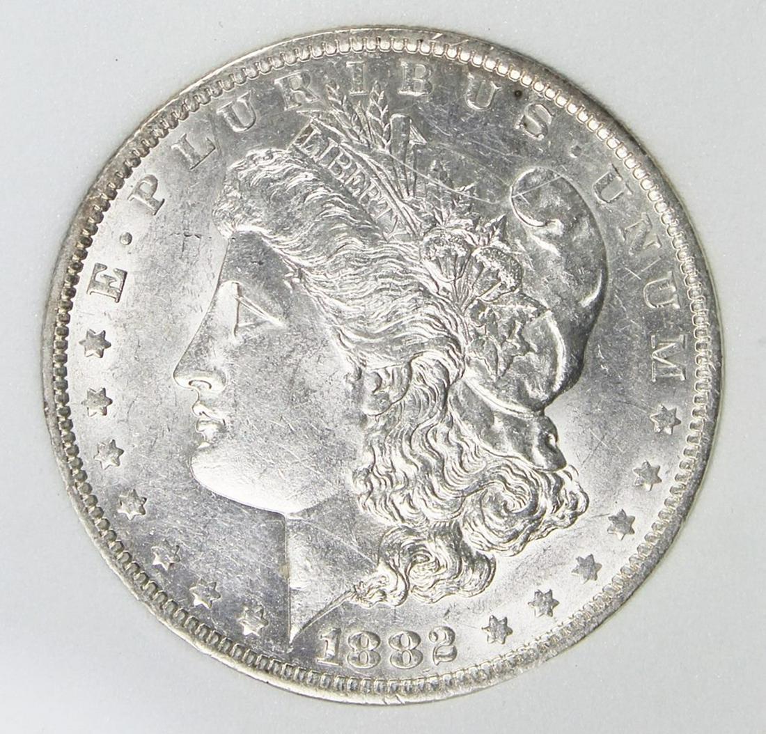 1882-O/S MORGAN SILVER DOLLAR: CCGS GRADED MS 64 WHITE. SCARCE. ESTIMATE: $675-$875