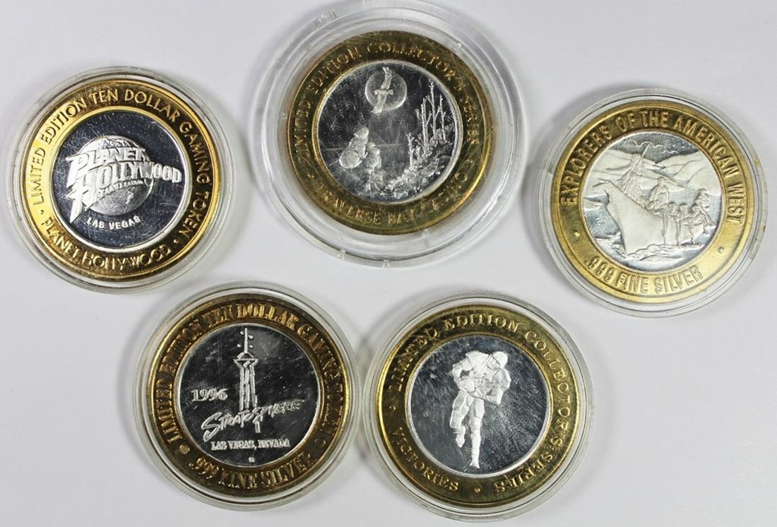 FIVE MISCELLANEOUS SILVER CASINO TOKENS (1 of 2)