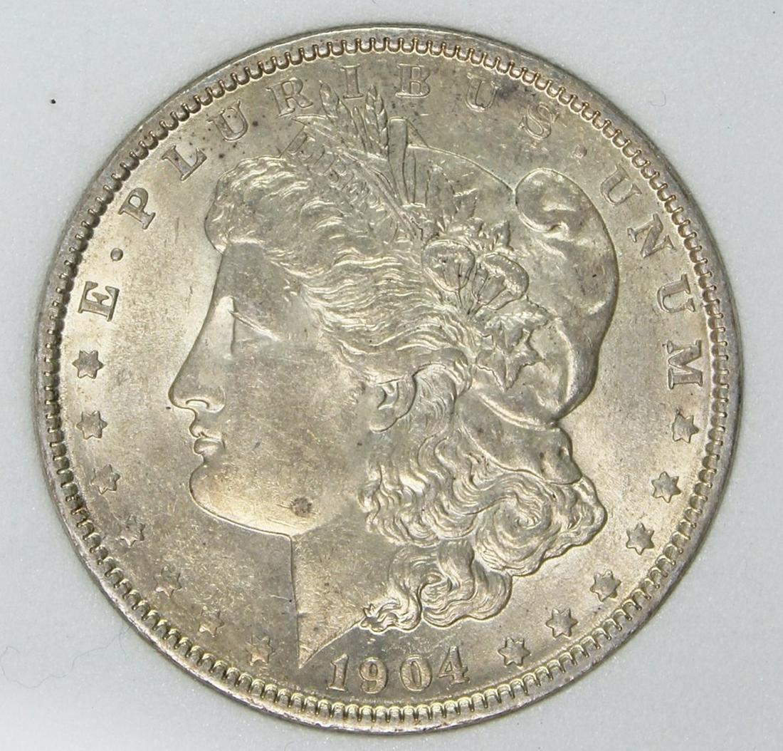 1904 MORGAN SILVER DOLLAR: CCGS GRADED MS 634 WHITE. ESTIMATE: $425-$525