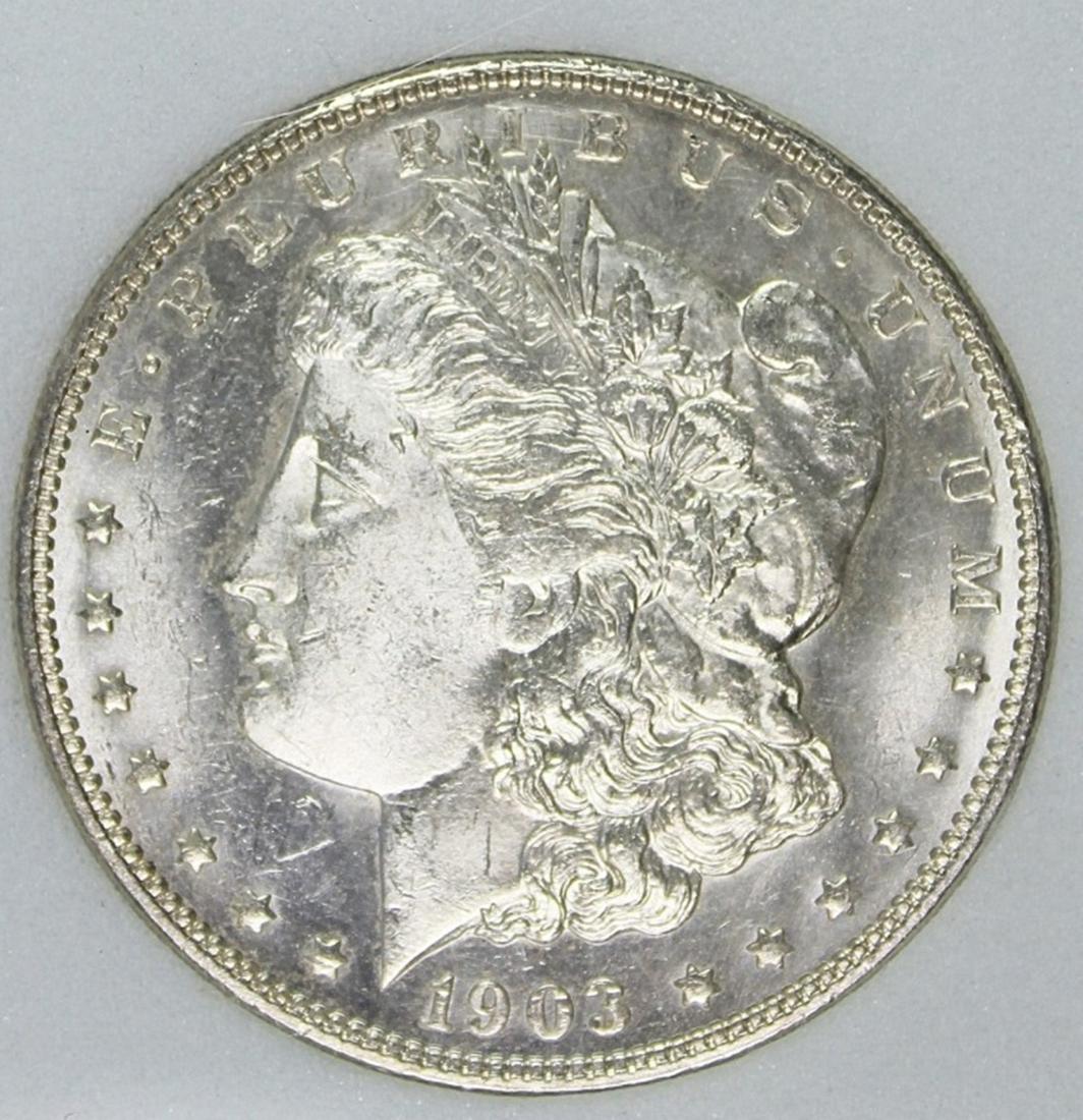 1903 MORGNA SILVER DOLLAR: PNA MS 65 PL BLAST WHITE AND SCARCE COIN. ESTIMATE: $600-$800