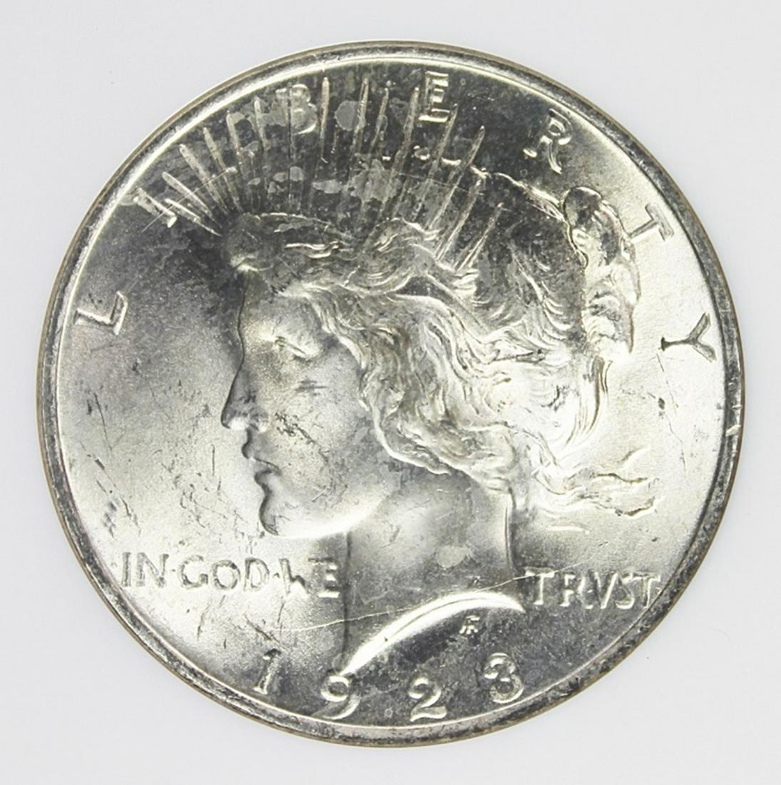 1923 PEACE SILVER DOLLAR: NGC MS 65 GEM WHITE. ESTIMATE: $120-$150