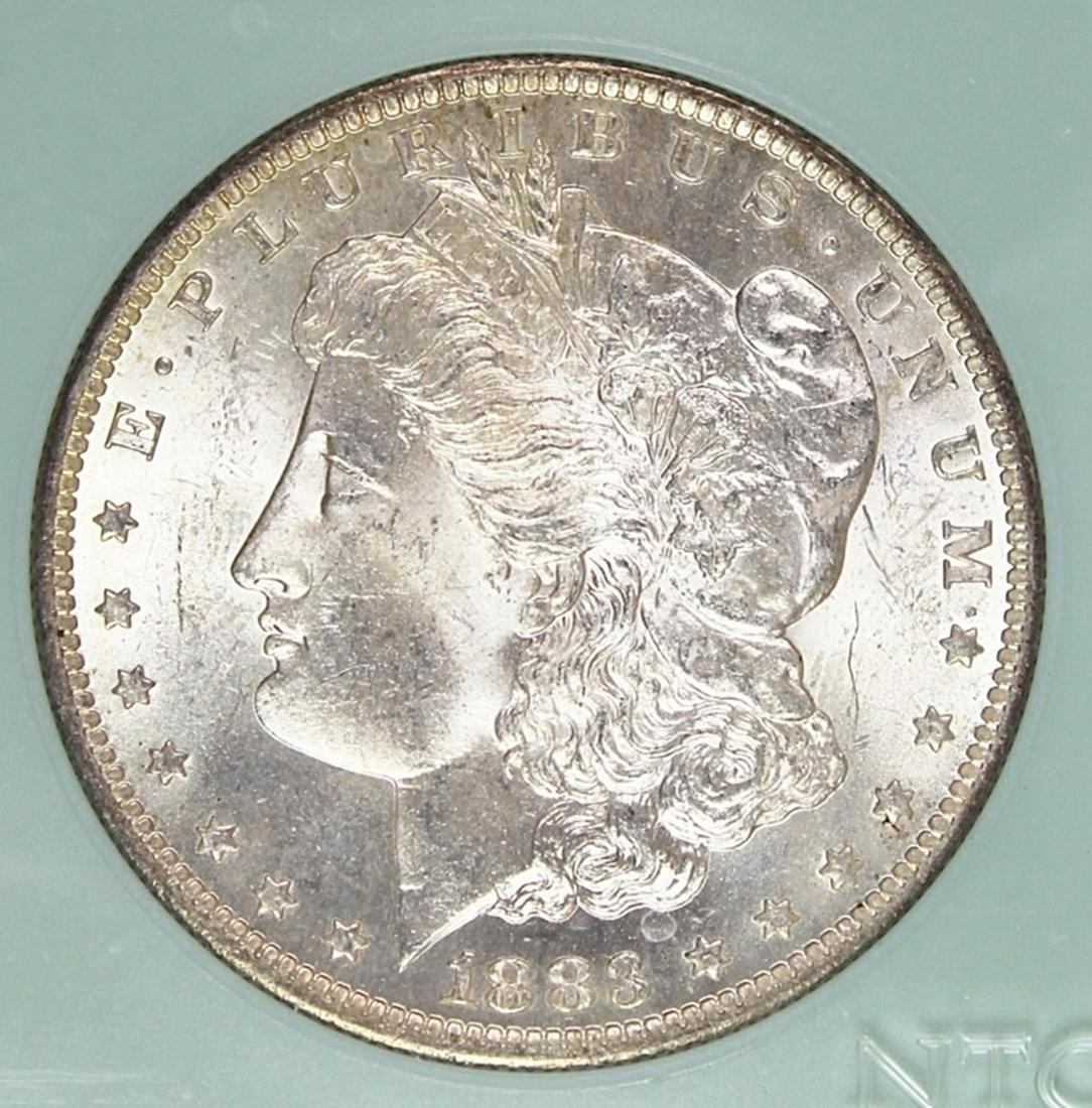1883-O MORGAN SILVER DOLLAR: NTC MS 67 BLAST WHITE. ESTIMATE: $425-$550