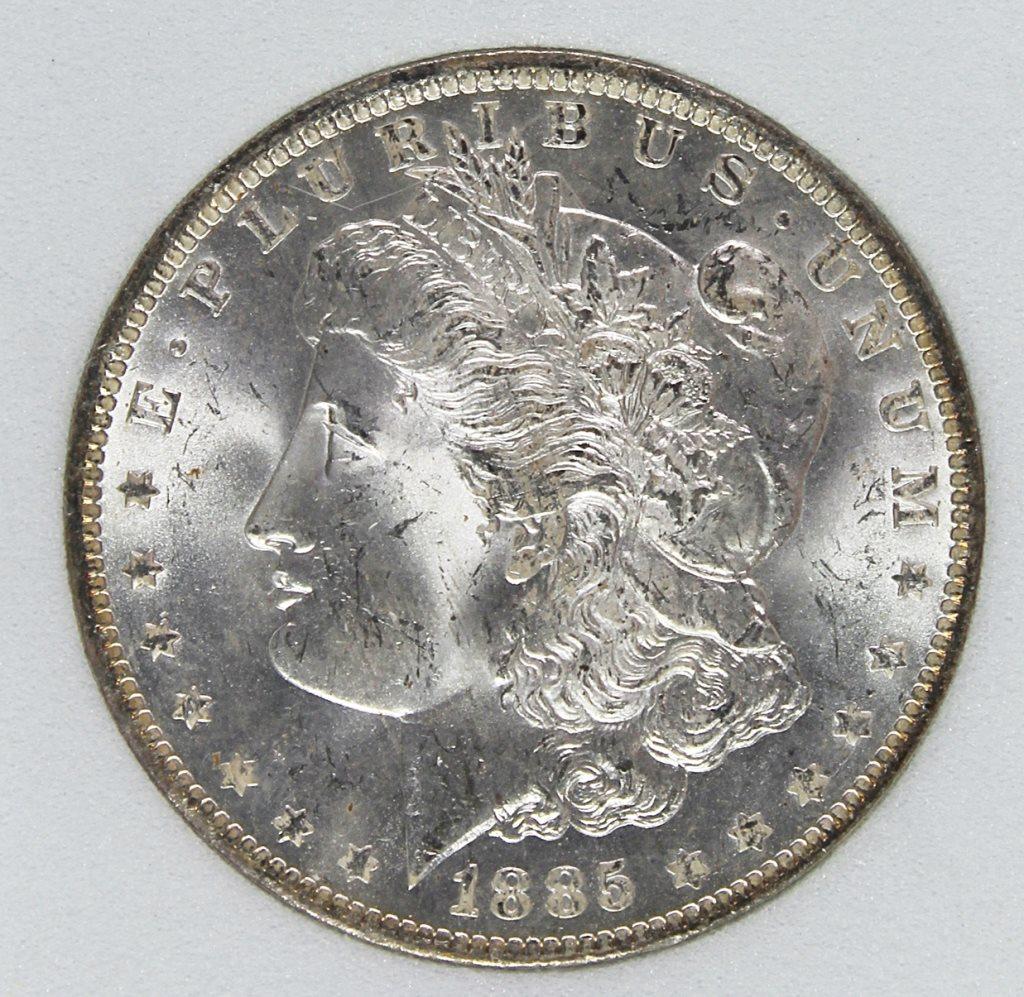 1885-O MORGAN SILVER DOLLAR: RNG MS 67+. SUPERB. BLAST WHITE. ESTIMATE: $325-$425