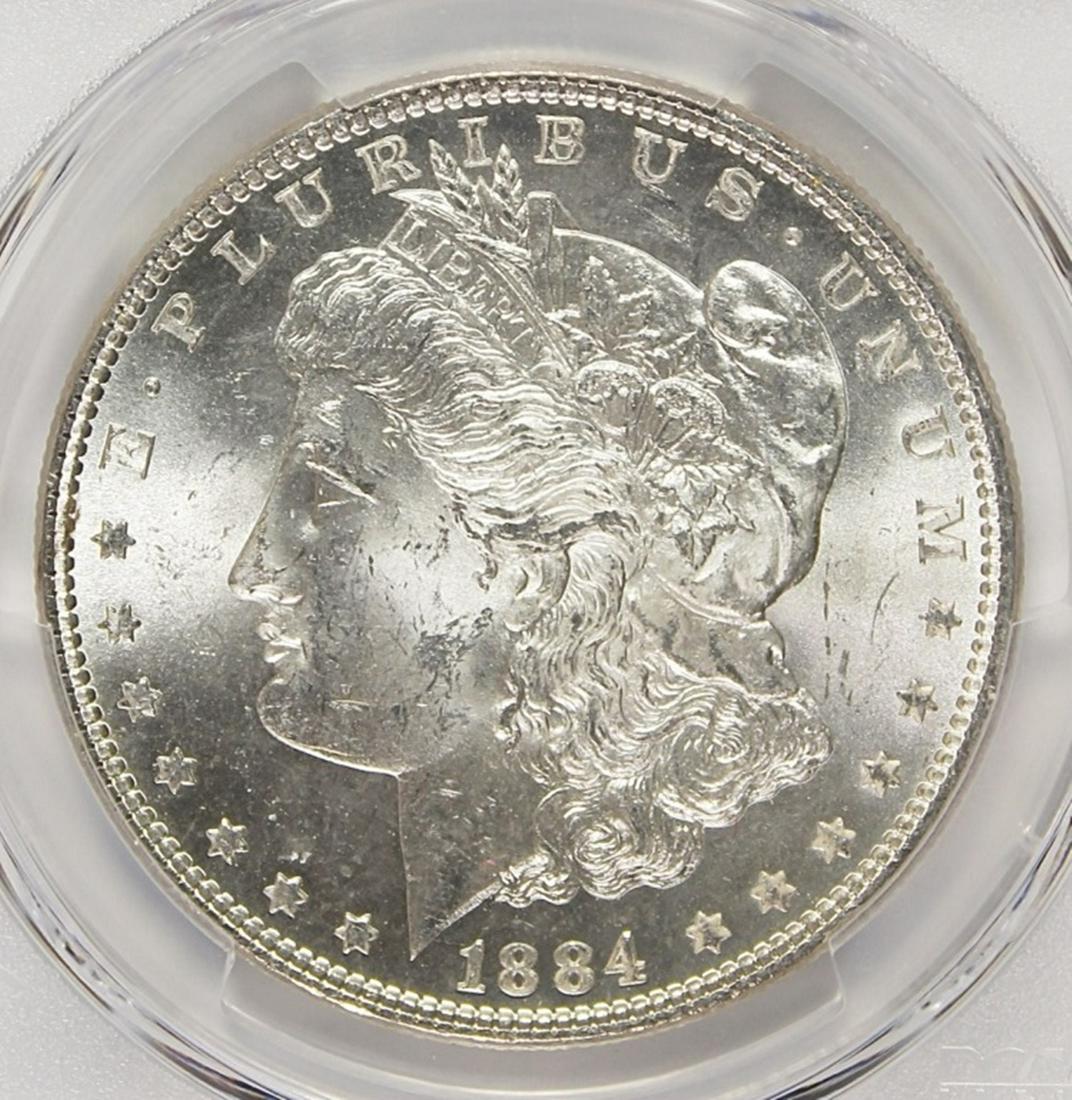 1884 MORGAN SILVER DOLLAR: PCGS MS 63 BLAST WHITE! ESTIMATE: $110-$150
