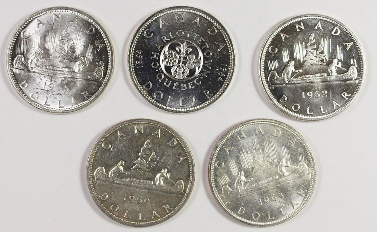 GEM BU CANADA SILVER DOLLARS (1 of 2)