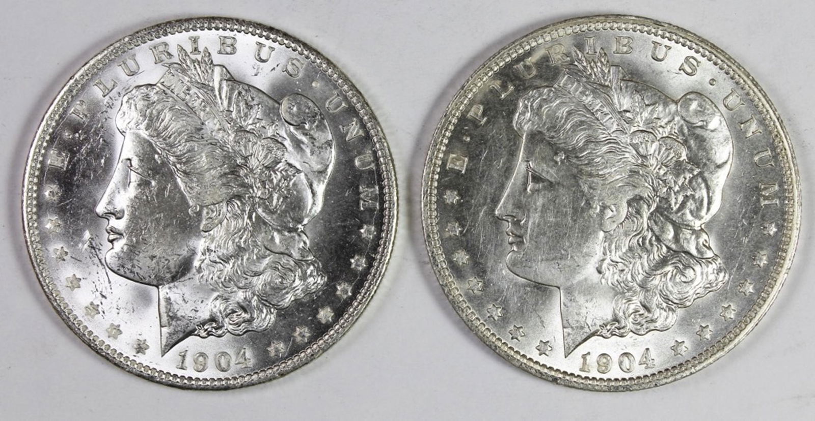 (2) 1904-O MORGAN SILVER DOLLARS (1 of 2)