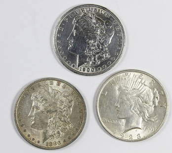 (3) SILVER DOLLARS: 1923 AU, 1900 AU AND 1880-O AU/UNC. ESTIMATE: $110-$150