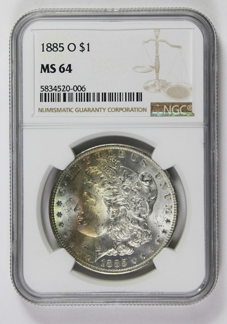 1885-O MORGAN SILVER DOLLAR: NGC MS 64 BLAST WHITE WITH OSME BEAUTIFUL RAINBOW COLORS ON OBVERSE. ESTIMATE: $200-$250