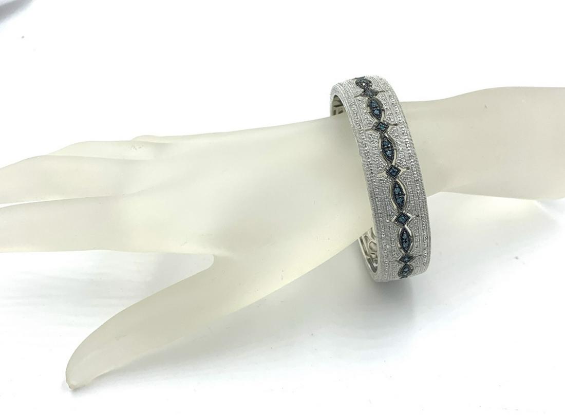 STERLING SILVER FILIGREE CUFF WITH DIAMONDS: LIKE NEW, NEVER WORN. BLUE AND WHITE DIAMONDS APPROXIMATE 3/4 CT TOTAL WEIGHT. MACY'S SELLS ONE LIKE THIS FOR $1200! SEE PHOTOS, ESTIMATE $800-$1000