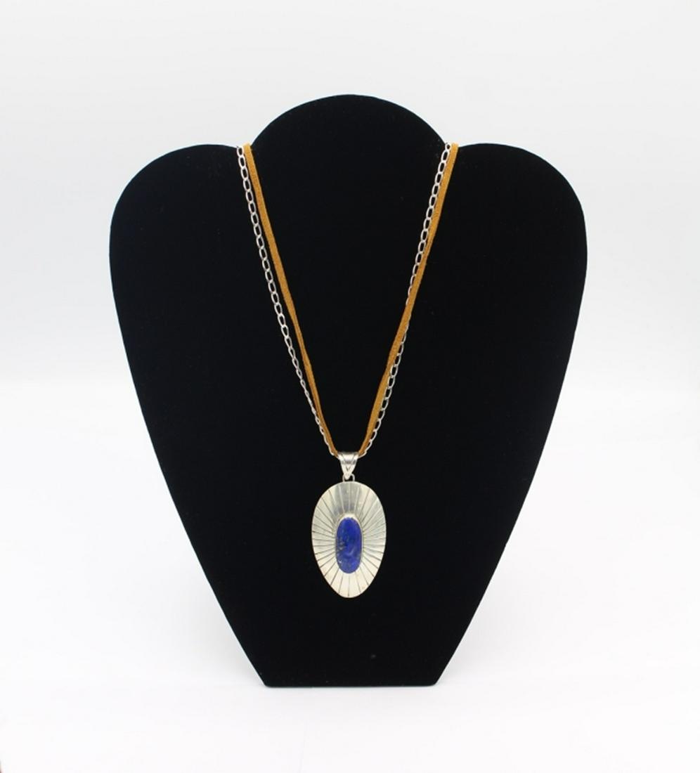 MEXICO .925 RAGUL CANO CONCH STYLE NECKLACE: LAPIS LAZULI. DOUBLE STRAND. SILVER CHAIN AND BROWN LEATHER. 25" LONG. 34 GRAMS TOTAL. ESTIMATE: $200-$250
