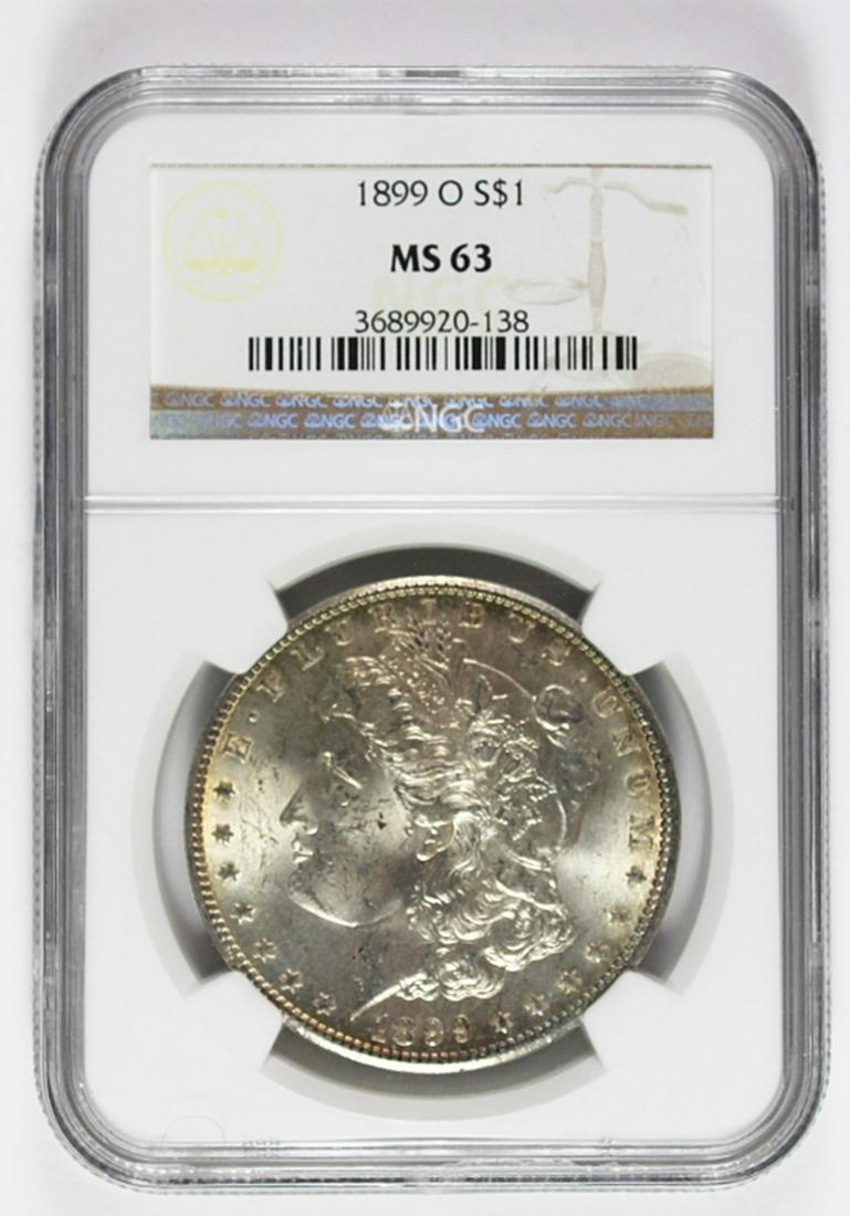 1899-O MORGAN SILVER DOLLAR: NGC MS 63 WHITE AND GOLD. ESTIMATE: $100-$150