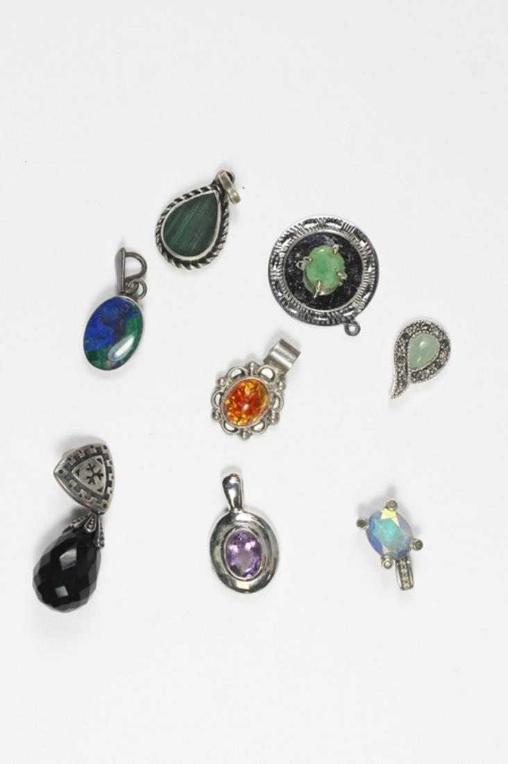 (8) STERLING SILVER PENDANTS AND CHARMS: VARIOUS DESIGNS. SEE PHOTOS. 23.3 GRAMS TOTAL. ESTIMATE: $30-$50