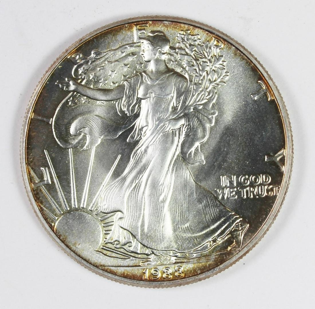 1988 AMERICAN SILVER EAGLE: GEM BU. RIM COLOR! ESTIMATE: $50-$75