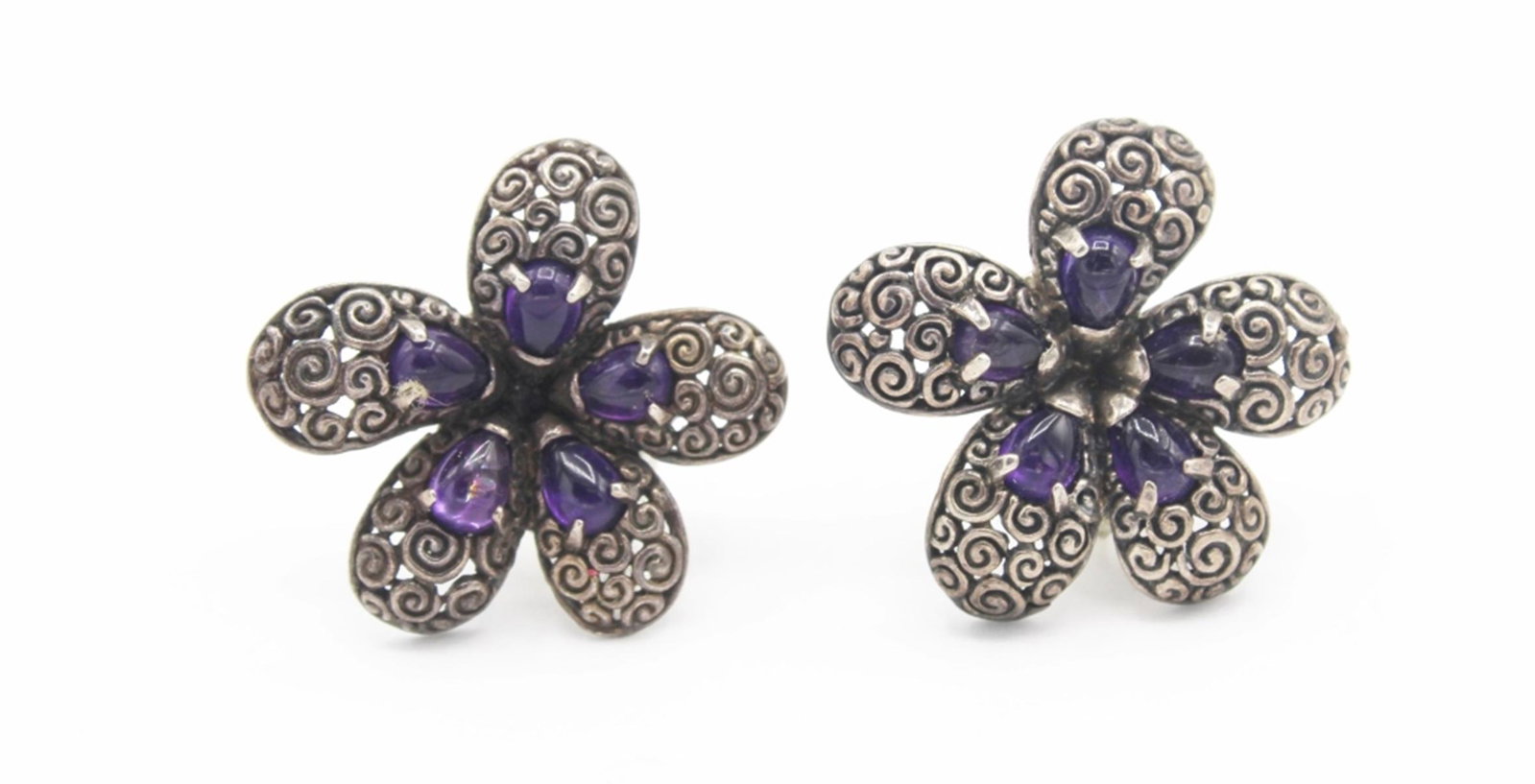 VINTAGE STERLING SILVER EARRINGS: AMETHYST ORNATE SIGNED "NV" FOR PIERCED EARS. WEIGHT 10.9 GRAMS AND 1" X 1 ". ESTIMATE: $50-$75