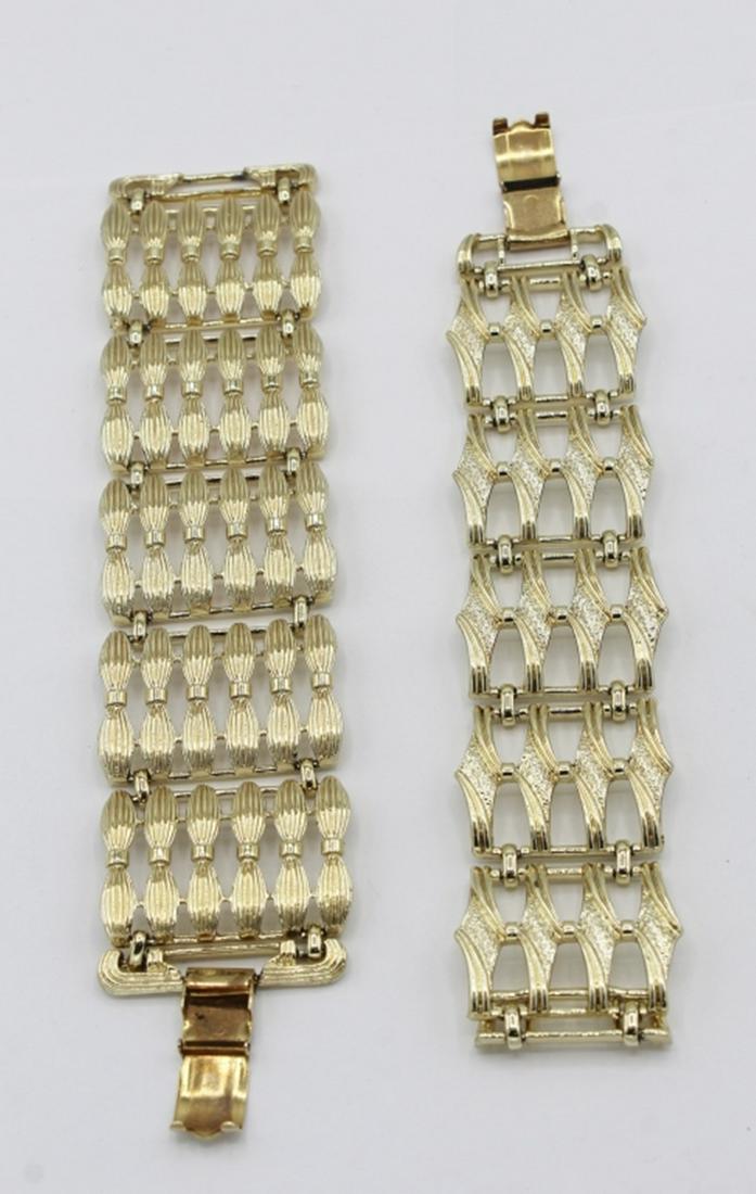 (2) VINTAGE CORO BRACELETS: WIDE TEXTURED GOLD TONE LINK BRACELETS. BOTH ARE 7" LONG. ESTIMATE: $75-$100