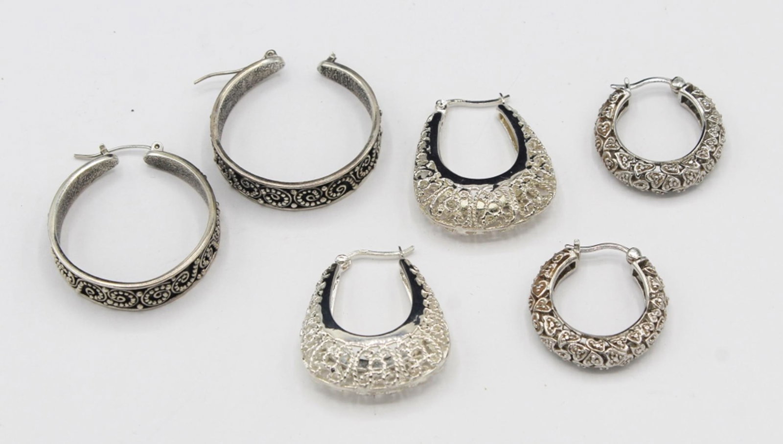 LOT OF THREE SETS OF STERLING SILVER EARRING SETS: WEIGHT 33.7 GRAMS. FOR PIERCED EARS. ESTIMATE: $50-$100