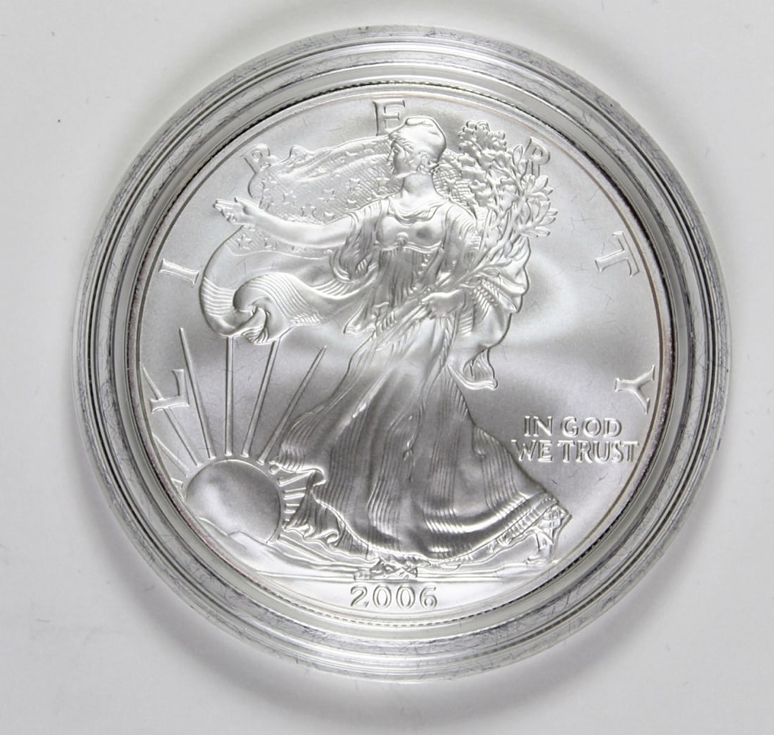 2006-W AMERICAN SILVER EAGLE: SUPERB GEM BU! COMES WITH BOX AND VELVET POUCH. ESTIMATE: $100-$150