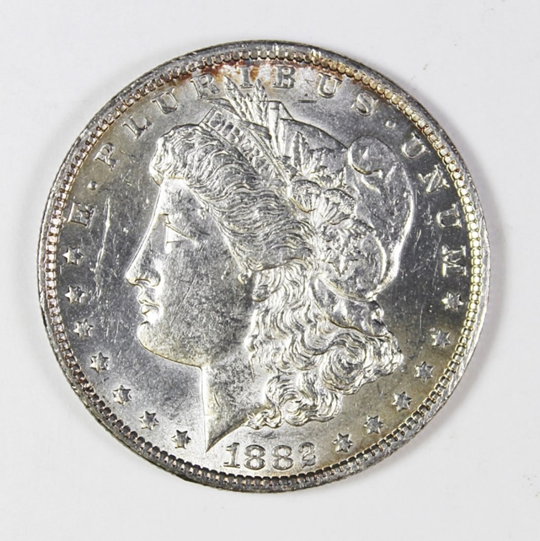 1882-CC MORGAN SILVER DOLLAR: BU. LIGHT RIM COLOR. ESTIMATE: $300-$400