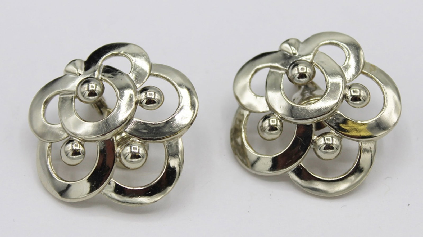 PAIR OF MONET EARRINGS: CLIP BACK STYLE. SILVER TONED. ESTIMATE: $1-$50