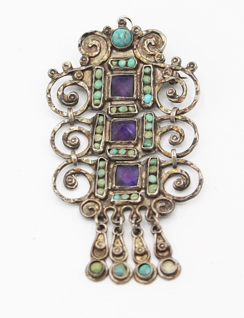 MATILDE POULAT TAXCO BROOCH/PIN: STAMPED TAXCO MEXICO. STERLING SILVER. AMETHYST STONE SURROUNDED WITH TURQOISE. 2 3/4" X 3". ESTIMATE: $500-$600