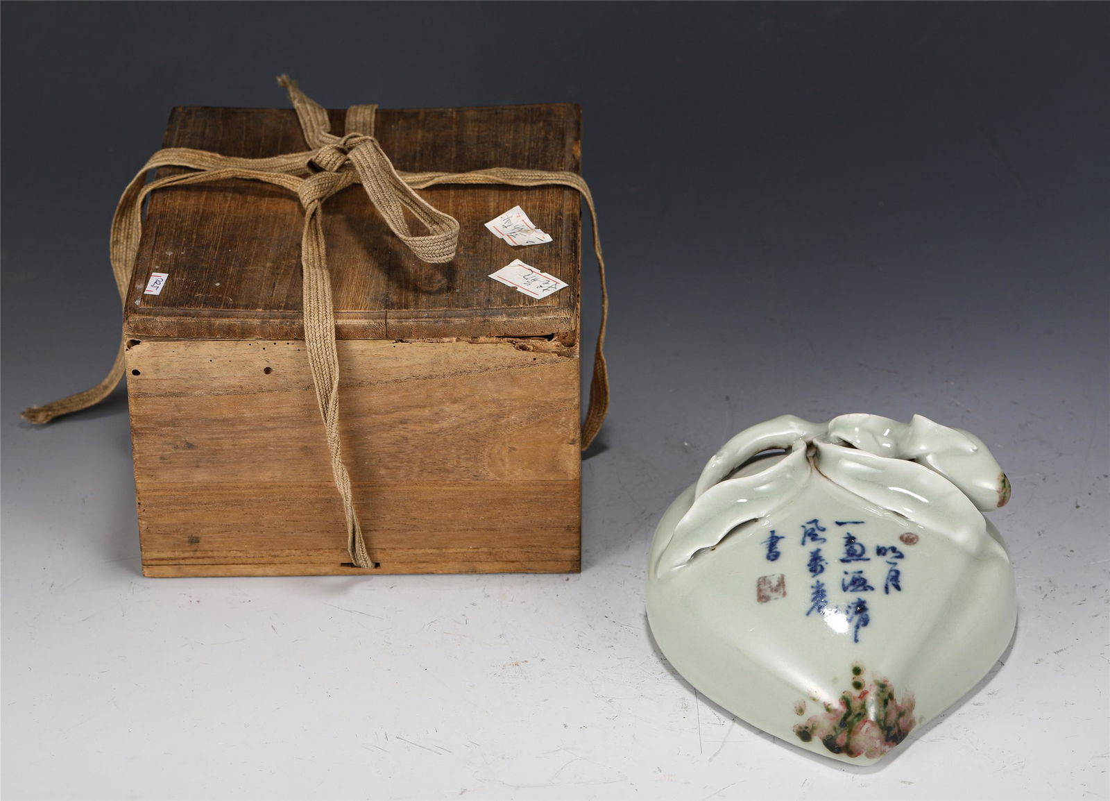 A CHINESE GUAN-TYPE GLAZED PEACH SHAPED ORNAMENT (1 of 10)