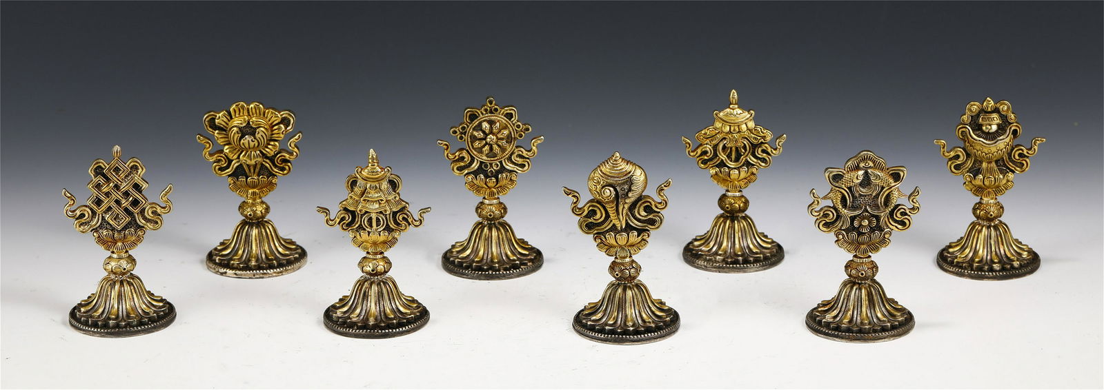 A SET OF EIGHT SILVER GILT BUDDHIST INSTRUMENTS (1 of 9)
