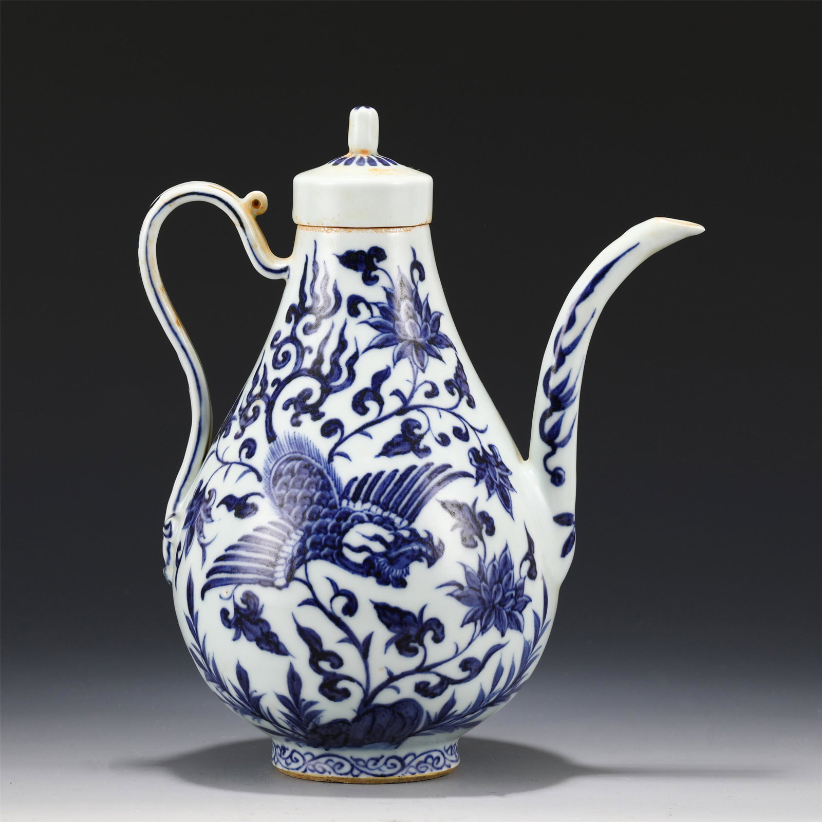 A BLUE AND WHITE PEAR SHAPED EWER WITH COVER: A BLUE AND WHITE PEAR SHAPED EWER WITH COVER Dimension: H. 23 cm. L. 19 cm. W. 11 cm. Weight 890 gram.