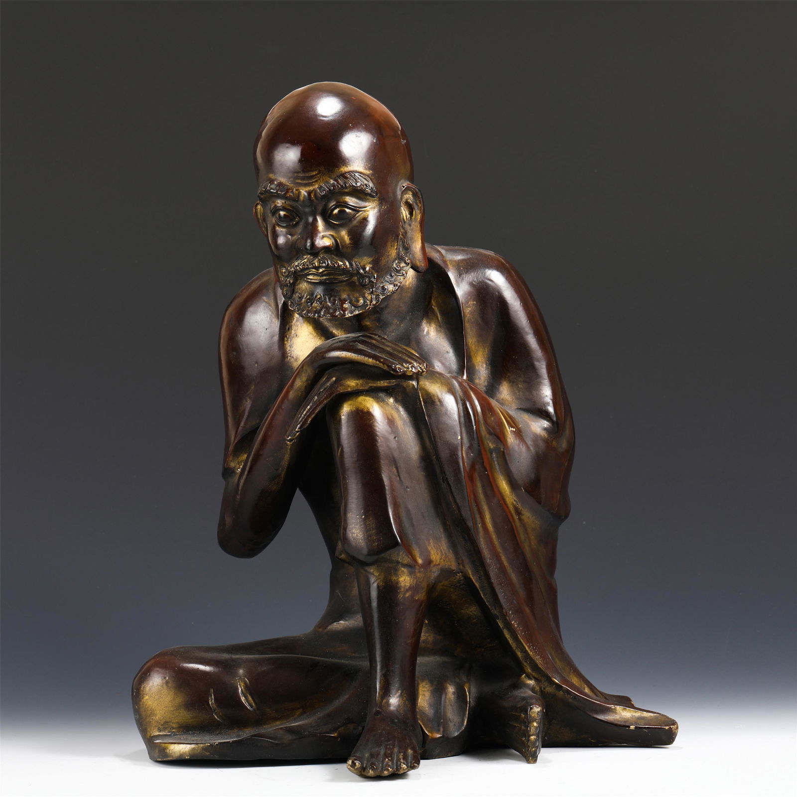 A BRONZE SEATED ARHAT (1 of 8)