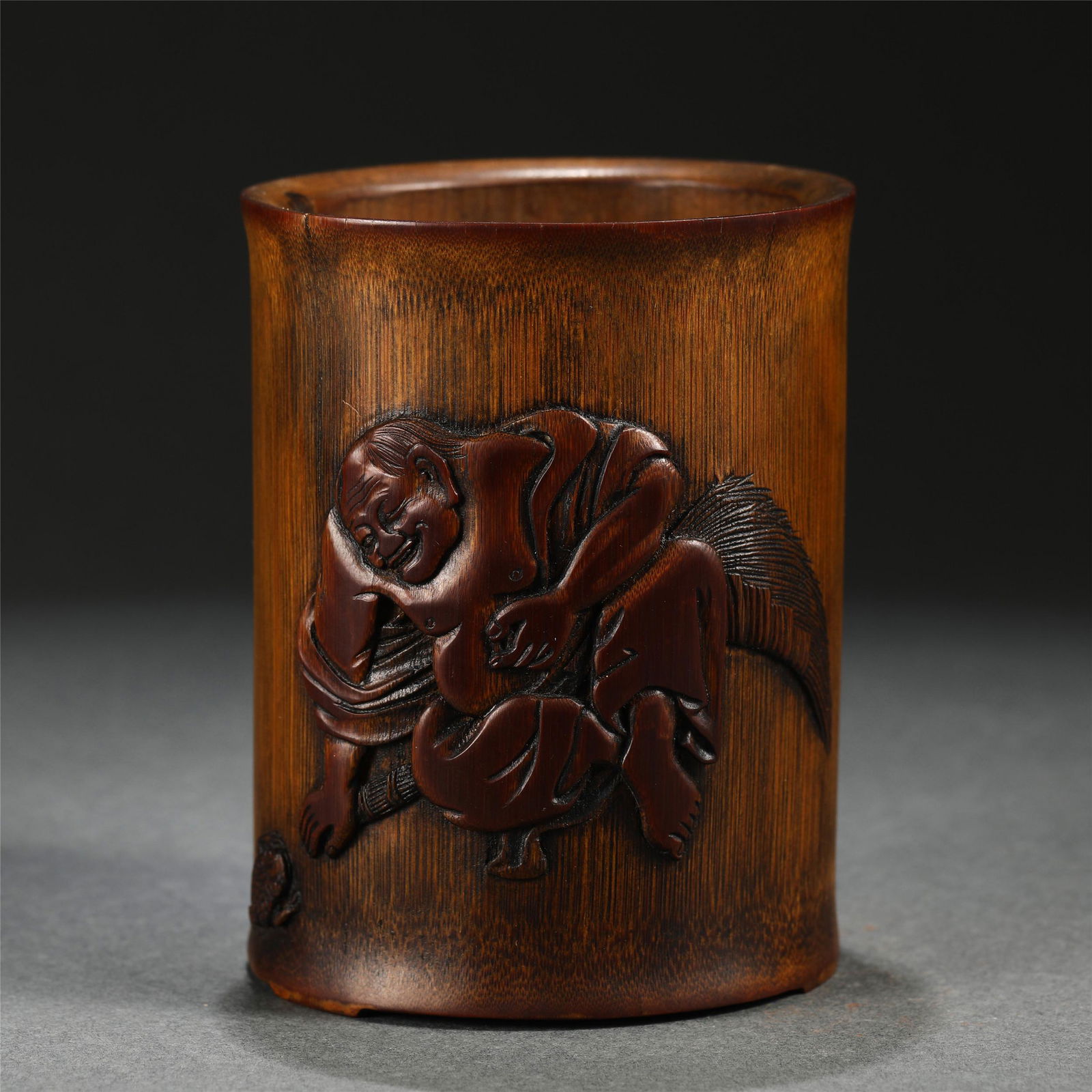 A CARVED BAMBOO FIGURAL BRUSH POT (1 of 7)