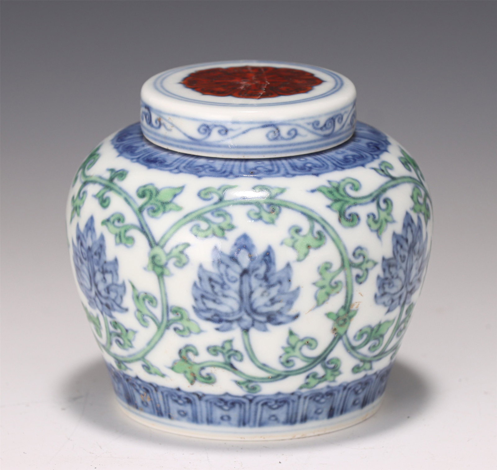 A DOUCAI GLAZED LOTUS SCROLLS JAR (1 of 9)
