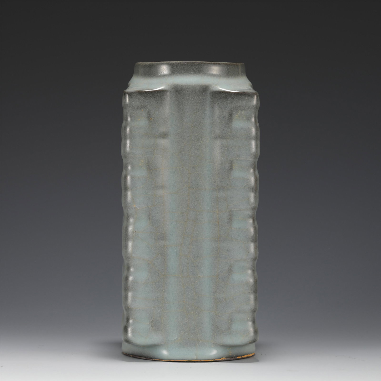 A JUN-WARE CONG VASE: A JUN-WARE CONG VASE with moulded sides, decorated in a bluish cream coloured glaze Dimension: L. 10 cm. H. 21 cm. Weight 1190 grams.