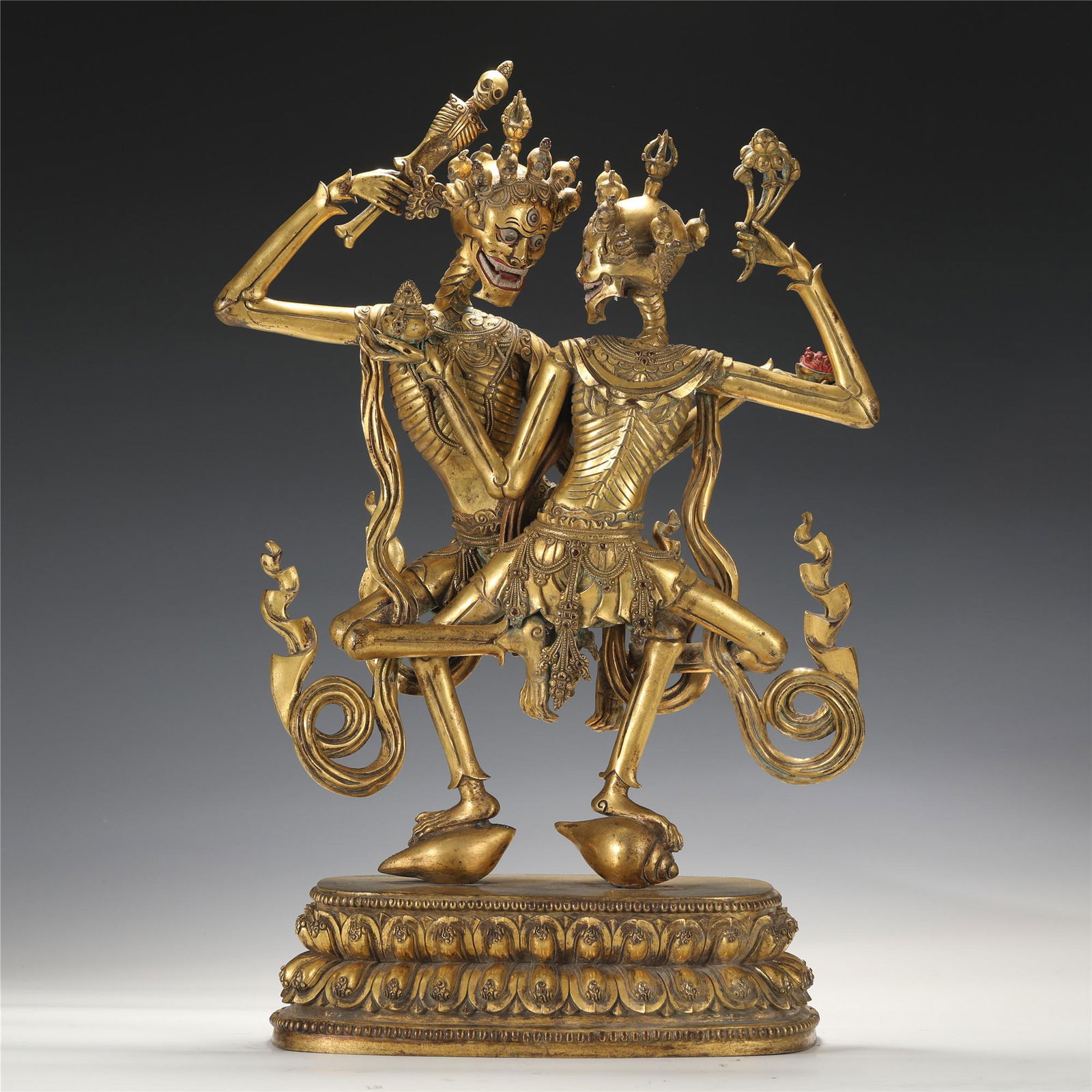 A TIBETAN BRONZE-GILT STANDING CHITIPATI (1 of 9)