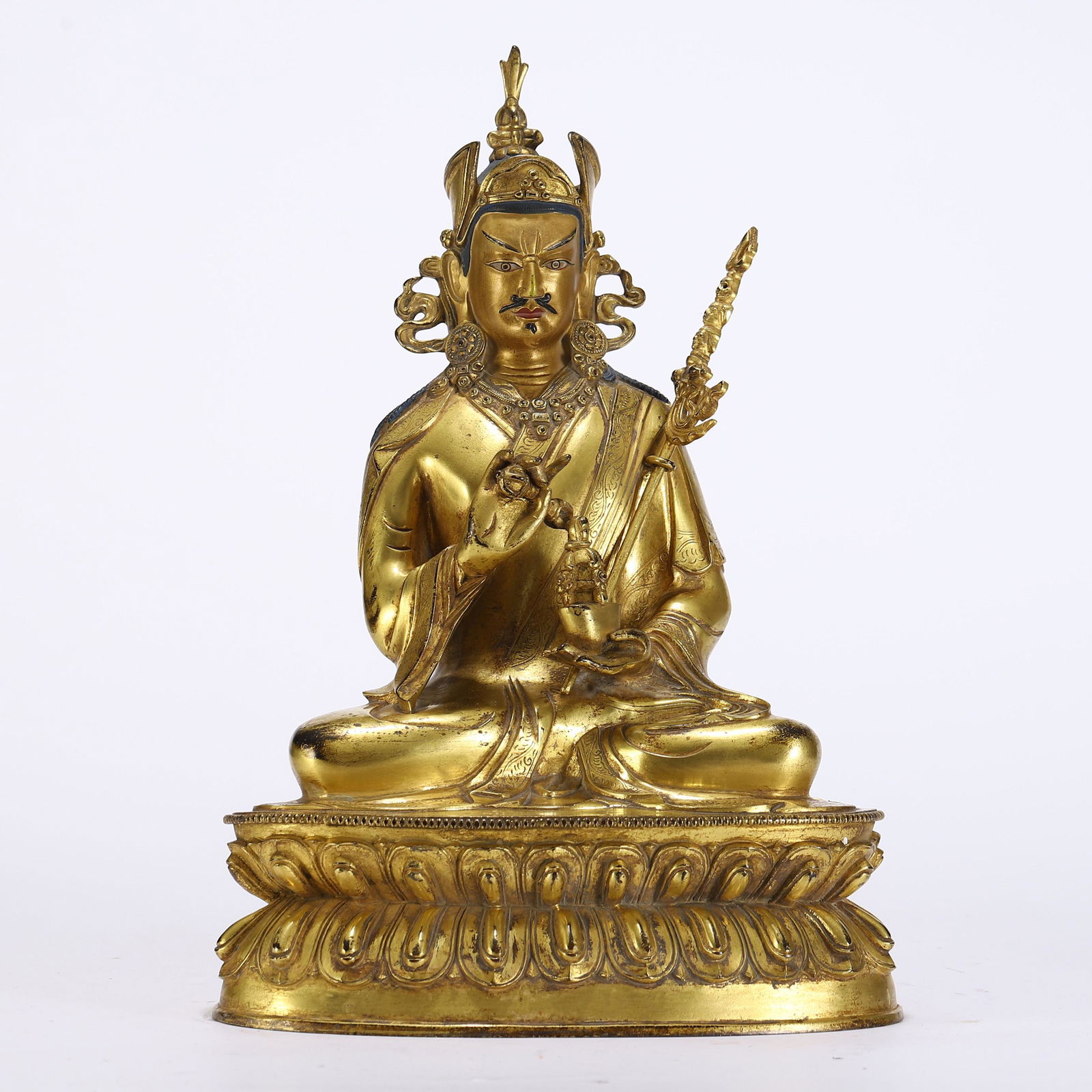 A TIBETAN BRONZE-GILT SEATED PADMASAMBHAVA (1 of 9)