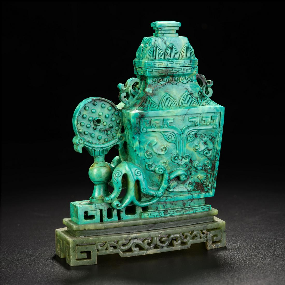A CARVED TURQUOISE VASE (1 of 11)