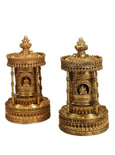 PAIR IMPORTANT SINO-TIBETAN BRONZE-GILT SHRINES: PAIR IMPORTANT SINO-TIBETAN BRONZE-GILT SHRINES The bronze-gilt niche with circular roof, the inner part of the niche containing the bronze-gilt prayer wheel with reserved shrine at the four sides,