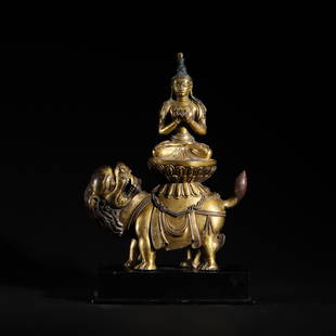 A CHINESE BRONZE-GILT FIGURE OF MANJUSRI: A CHINESE BRONZE-GILT FIGURE OF MANJUSRI Manjushri is a popular Buddhist figure commonly represented in art. He first arises from the Mahayana Sutra literature of Northern Buddhism where he is