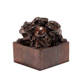 A CHINESE CARVED ALOESWOOD CHILONGS GROUP SEAL (1 of 9)
