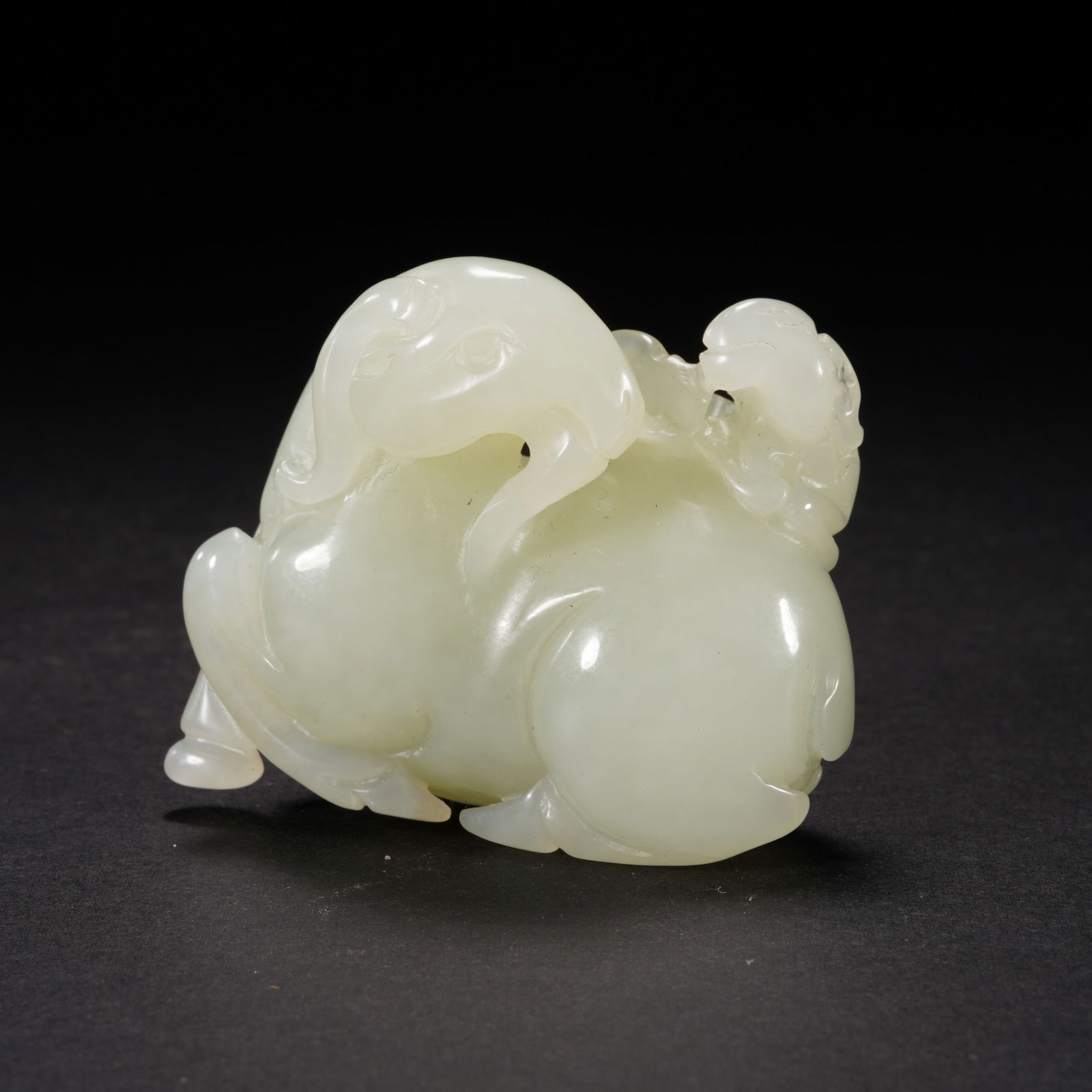 A CARVED WHITE JADE RAM PAPER WEIGHT (1 of 7)