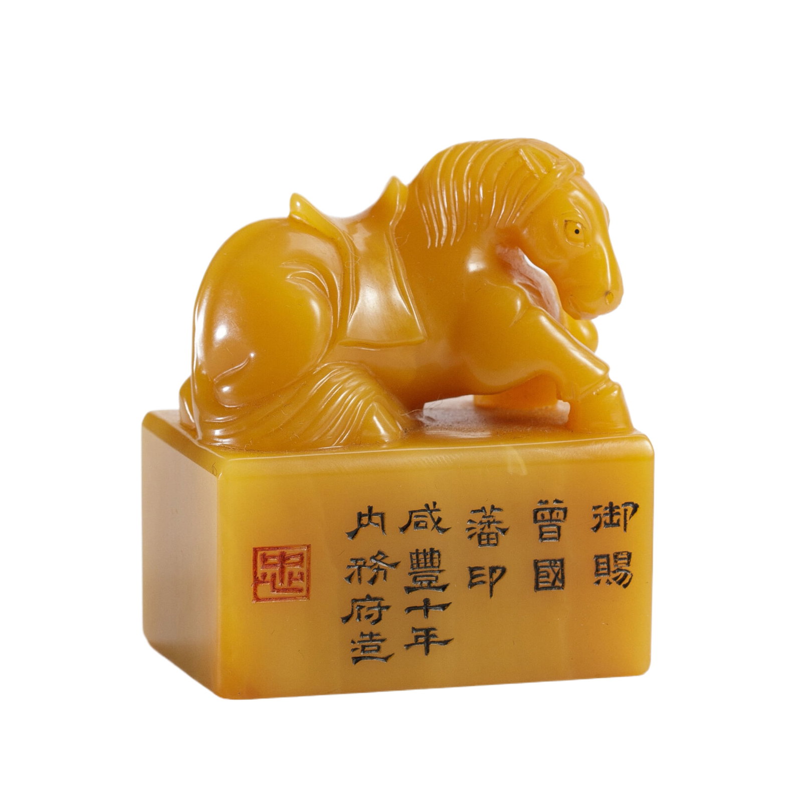 A CARVED AND INSCRIBED TIANHUANG HORSE SEAL: A CARVED AND INSCRIBED TIANHUANG HORSE SEAL The rectangular-shaped seal is surmounted by a horse finial, inscribed and dated at the side, overall in a bright yellow tone. Dimension: L. 6 cm. W. 3.5 cm
