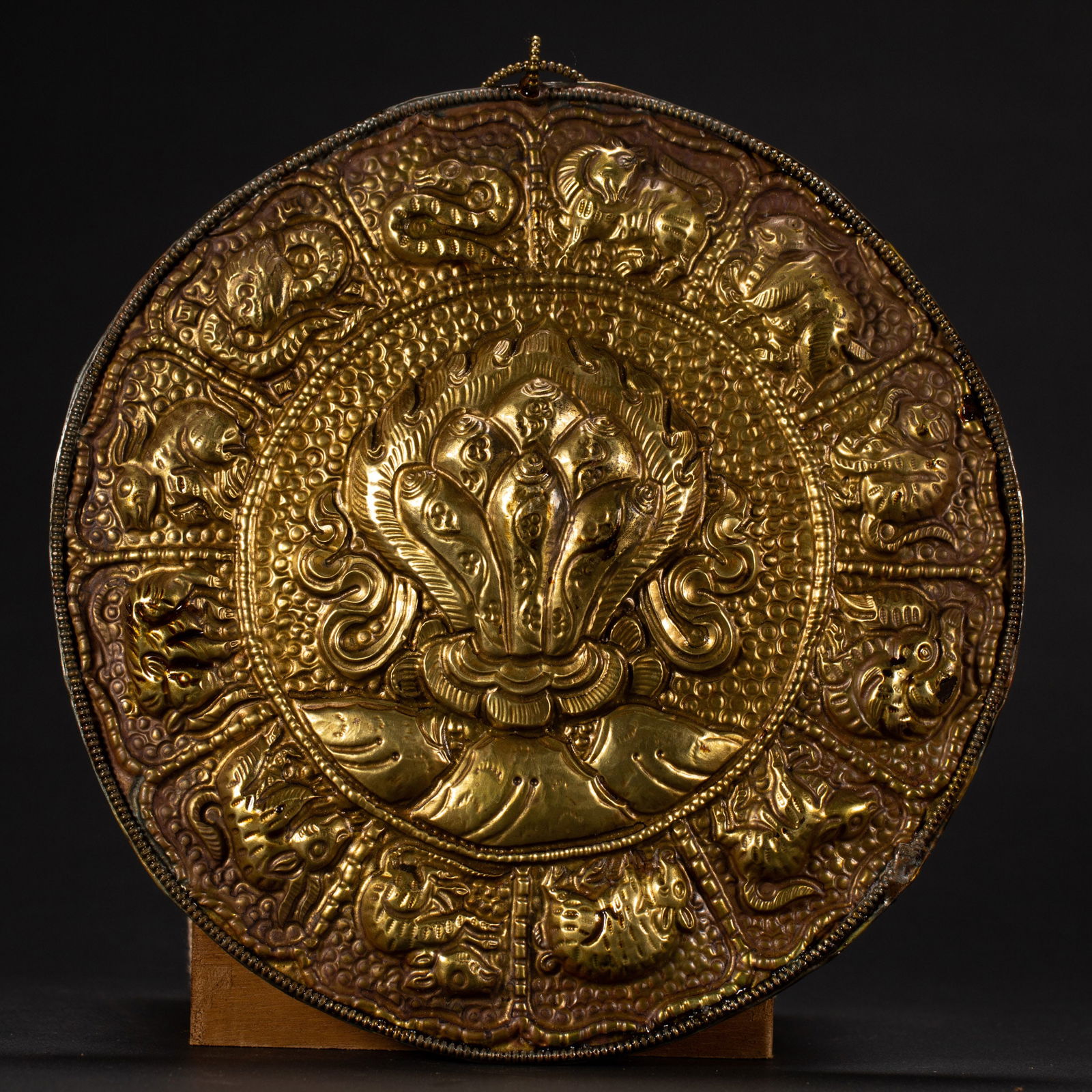A TIBETAN BRONZE-GILT CIRCULAR PANEL (1 of 6)
