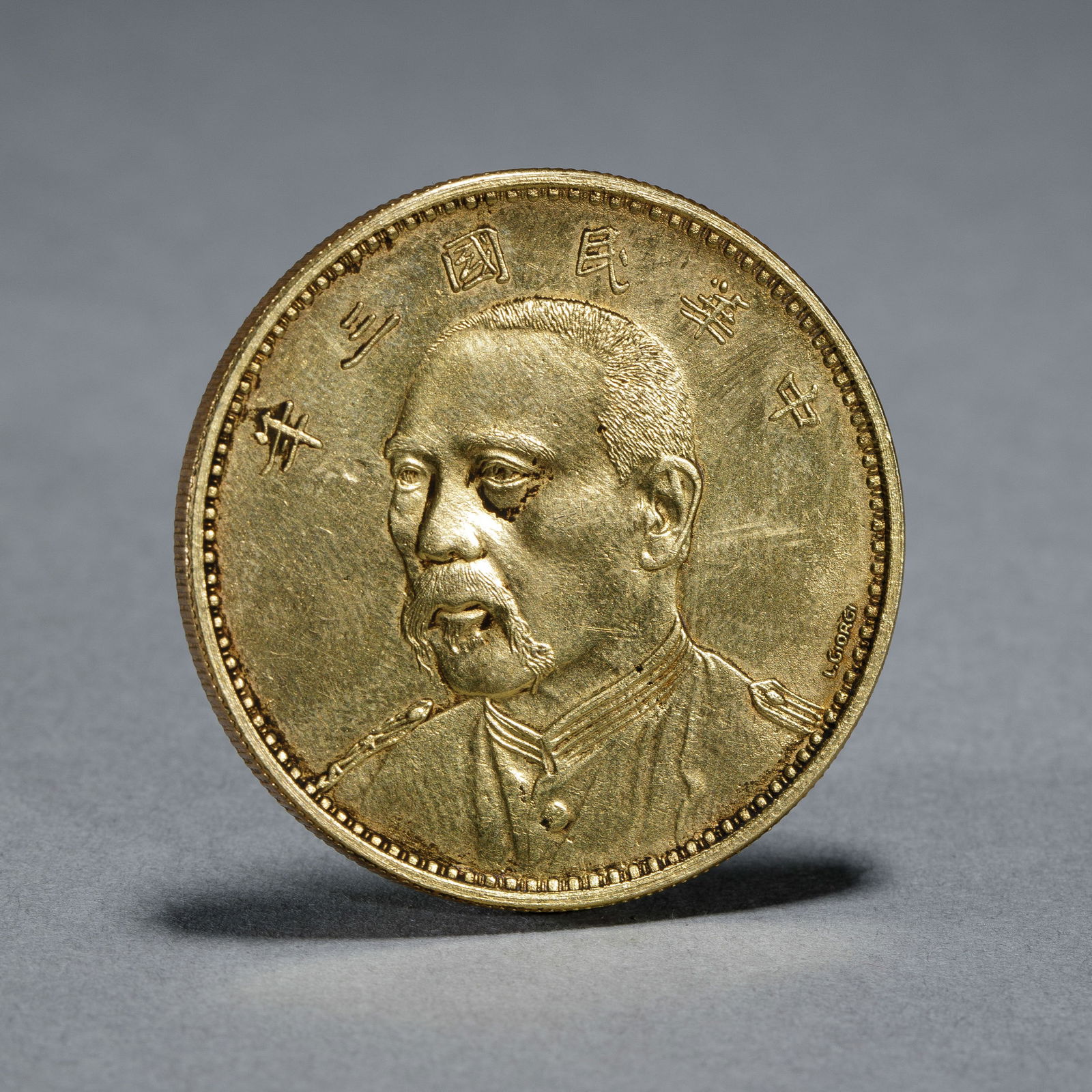 A CHINESE SILVER-GILT COIN (1 of 9)