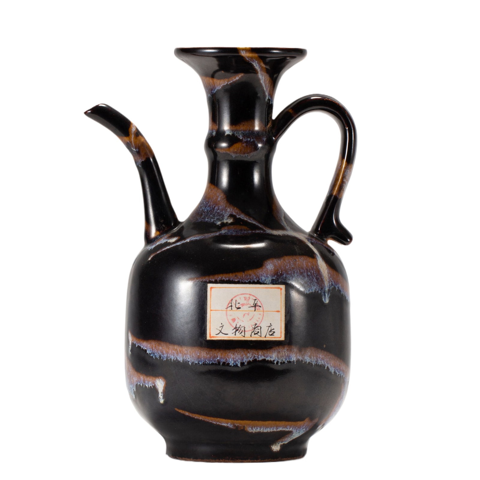 A TORQUISE GLAZE EWER: A TORQUISE GLAZE EWER The baluster teapot is molded with a curved, tapering spout and a rounded handle, and applied with tortoise glaze. Dimension: L. 15 cm. W. 11 cm. H. 22 cm. Weight 940 grams.