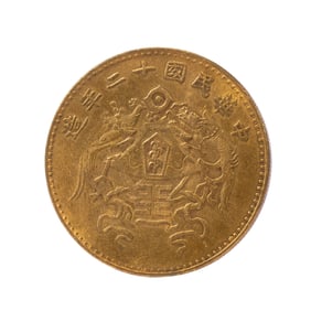 A SILVER-GILT COIN