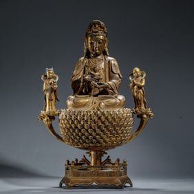 A BRONZE-GILT SEATED GUANYIN