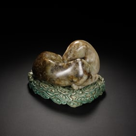 A CARVE JADE DOUBLE BADGERS