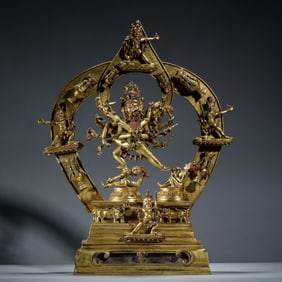 AN EXTREMELY RARE BRONZE-GILT DAKINI